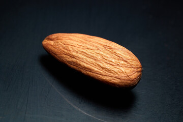 Almond on a dark scratched background