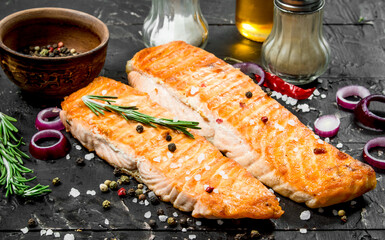 Grilled salmon fillet with spices and herbs.