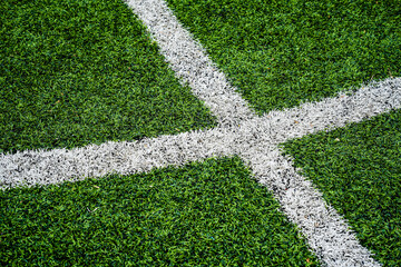 Close up soccer field lines. Background soccer pitch grass football stadium ground view. Stadium field ground grass detail. Ground football field grass macro. Design soccer stadium grass football line © Stone Story