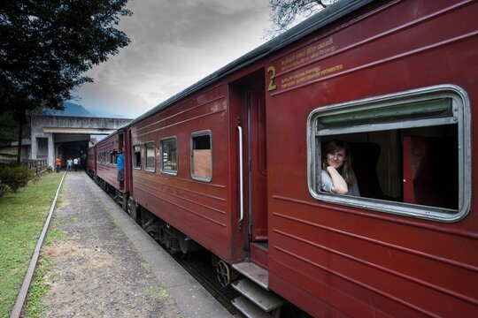 Woman waits for the tea train to depart