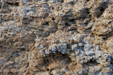 Close-up of the rocks. The background of the mountains. The texture of the stone.