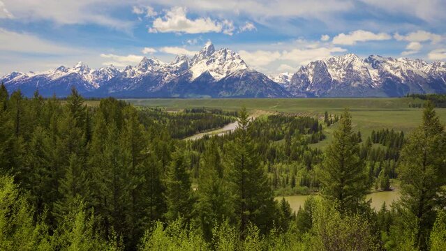 Pan right of Snake River and Grand Teton Mountains in Wyoming, USA