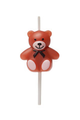 Subject shot of a colored cake candle in the shape of a teddy bear. The designer candle for the cake is isolated on the white background.