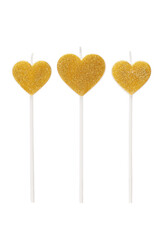 Subject shot of three white and golden cake candles in the shape of a heart. Designer candles for the cake is isolated on the white background.