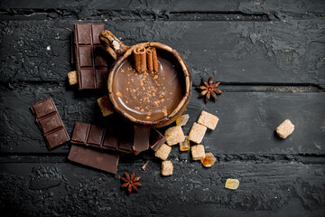 Fototapeta na wymiar Hot chocolate with cinnamon sticks.
