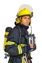 Young African American fireman with respirator and air breathing apparatus on his back in protective uniform isolated on white background.