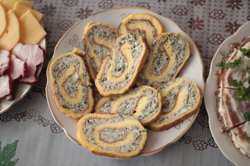 Meat rolls on the festive table