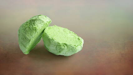 Green marshmallow. Marshmallows on a colored background. Two halves of marshmallows