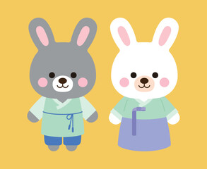 The year 2023 is called the year of the rabbit in Korea. Two cute rabbit characters are smiling while wearing 'Hanbok', the traditional Korean clothing.