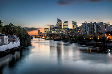 The seine River in Paris and the buildings that are build across it giving a nice reflection and a beautifull sunset/sunrise	