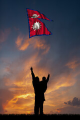 Father with son and the flag of Nepal