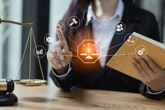 Concepts of Law and Legal services. Lawyer working with law interface icons. Blurred background, online lawyer advice.,