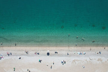 Fototapeta na wymiar Aerial view of beautiful blue gulf and Konyaalti beach in popular resort city Antalya, Turkey.