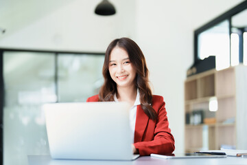 Portrait of a business woman talking on the phone and drinking coffee