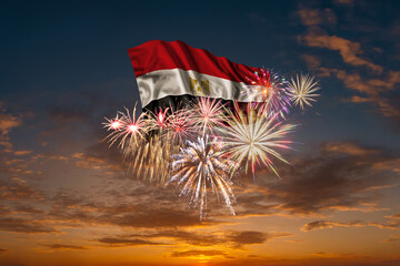 Flag of Egypt and Holiday fireworks in sky