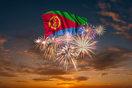 Flag of Eritrea and Holiday fireworks in sky