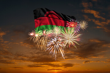 Flag of Malawi and Holiday fireworks in sky