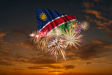 Flag of Namibia and Holiday fireworks in sky