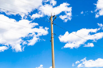 Power electric pole with line wire on colored background close up