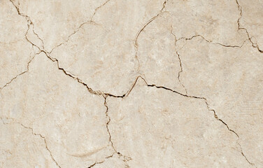 Cracked ground background in the top view for graphic design or wallpaper