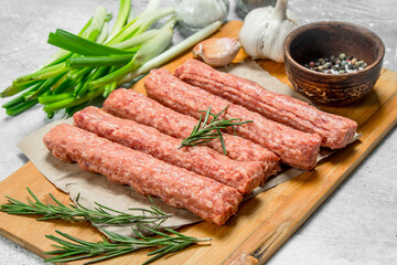 Raw beef sausages with garlic and herbs.