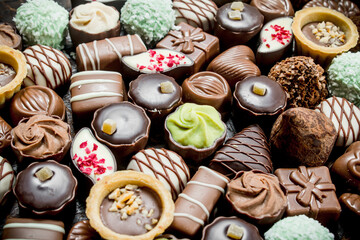 Chocolate candies with nuts and various fillings.