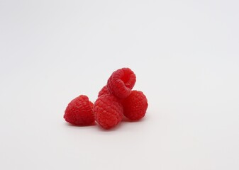 raspberries on a white background