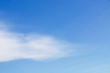 Blue sky with white cirrus cloud on a clear day