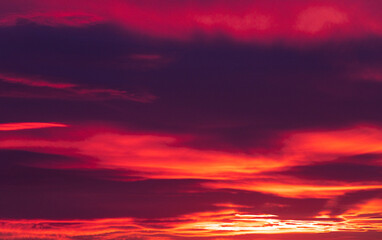 Naklejka na ściany i meble Sunset sky, orange and pink clouds