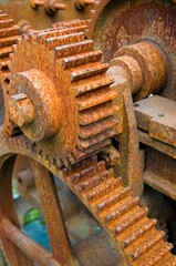 Rusty machinery with cogs and gears, used for rope making
