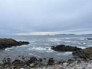Amazing rocky ocean bay, rocky coast, huge stones, seascape, cloudy sky, Nordic seascape