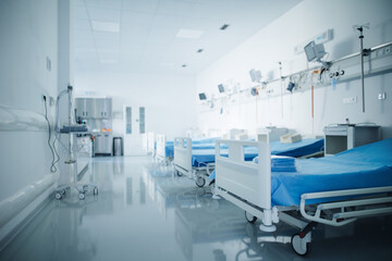 Close-up of empty hospital room with bed.