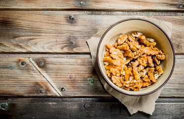 Shelled walnuts in a bowl.