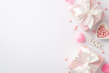 Valentine's Day concept. Top view photo of pastel pink present boxes with silk ribbon bows golden heart shaped confetti and sprinkles on isolated white background with copyspace