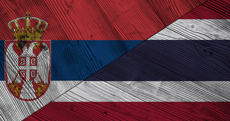 Background with flag of Serbia and Thailand on wooden divided table. 3d illustration