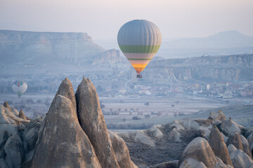 Nevsehir, Turkey - January 15, 2023: Hot Air Balloons at Sunrise in the Cappadocia Valley