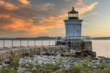 Portland Breakwater Light (also called Bug Light) in South Portland at dawn with yellow and orange...
