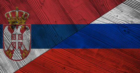 Background with flag of Serbia and Russia on wooden divided table. 3d illustration
