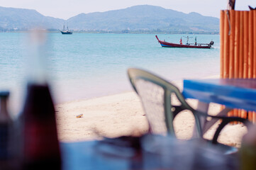Tropical beach with longtail boat.