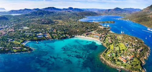 Poster Italy summer holidyas . Sardegna island - stunning Emerald coast (costa smeralda) with  beautiful beaches. aerial view of Ira beach with turquoise sea © Freesurf