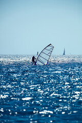 Windsurfer on the open sea ocean waters.