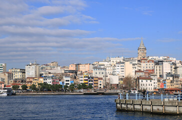 The Galata Tower and The Golden Horn in a cloudy day in Istanbul, Turkey.