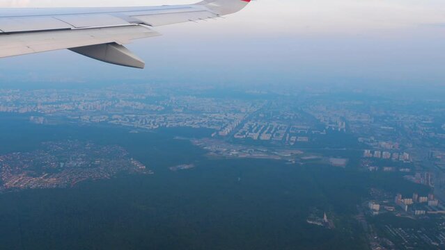 View from the airplane window on the wing and horizon, blue sky. Travel and tourism concept. Comfortable flight