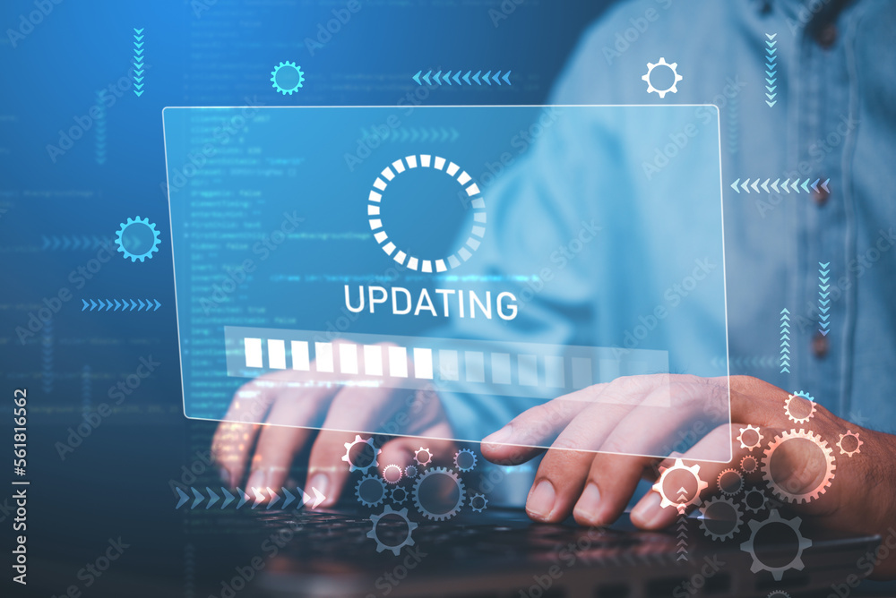Poster businessman hand working with laptop and virtual update screen , software system update process