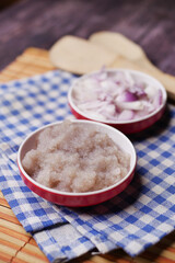 red onion paste in a container on table 