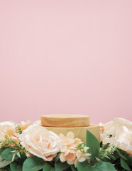empty wooden podium beige rose bouquet flowers decoration on pink background with space.beauty...