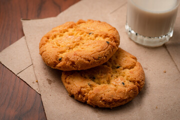 Closeup delicious Hong Kong butter cookie recipes on papers and wooden table.