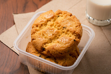 Closeup delicious Hong Kong butter cookie recipes on papers and wooden table.