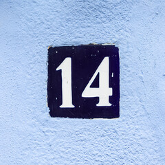 housing number 14 white on blue
