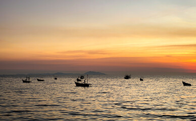 Sky sunset at beach scenery, Whether it's the warm hues of a sunrise or sunset, shimmering reflection of the sun on the clouds, the sky and clouds have the power to inspire feelings of awe and wonder